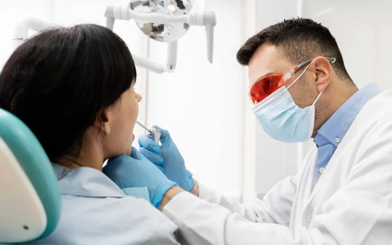 dentist doing check up patient