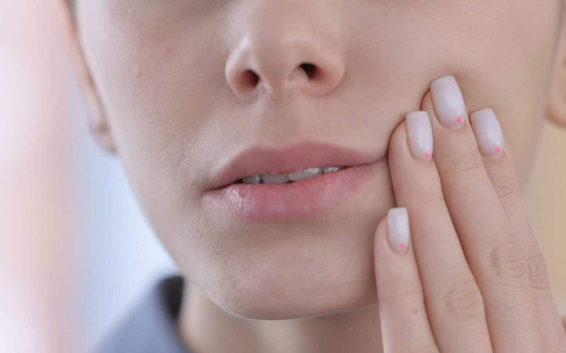 what are the symptoms of a tooth infection spreading